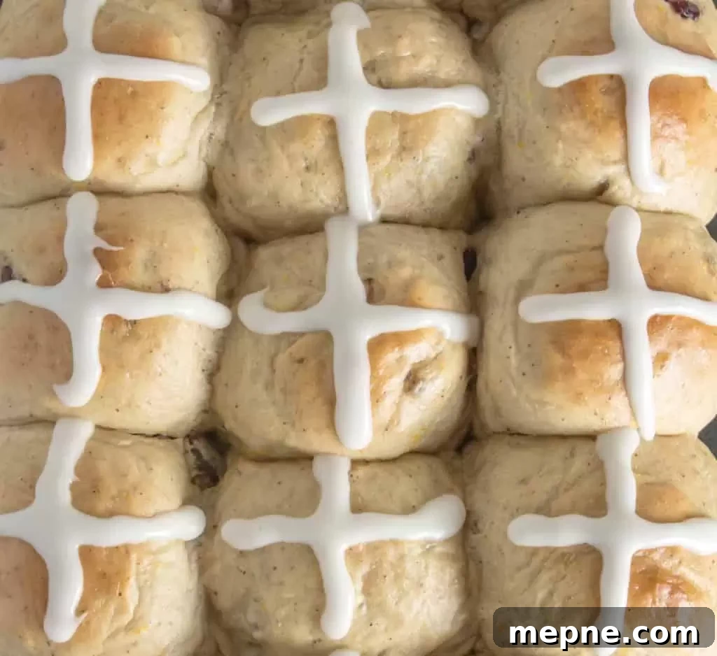 Cranberry Orange Hot Cross Buns Recipe 5 overhead shot of cranberry orange hot cross buns with frosting on top