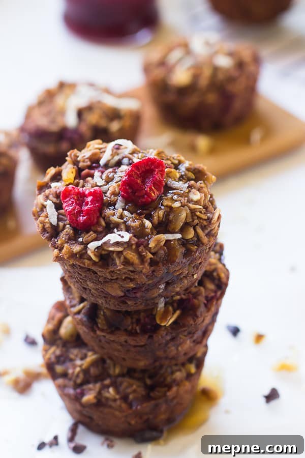 30 Freezer-Friendly Back-to-School Recipes 3 A stack of chocolate raspberry oatmeal cups on a table top.
