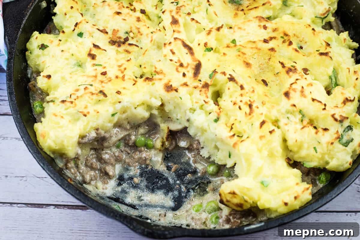 35 Classic Casserole Recipes That Have Everyone Coming Back 22 A Skillet Stroganoff Pie with a small missing portion.