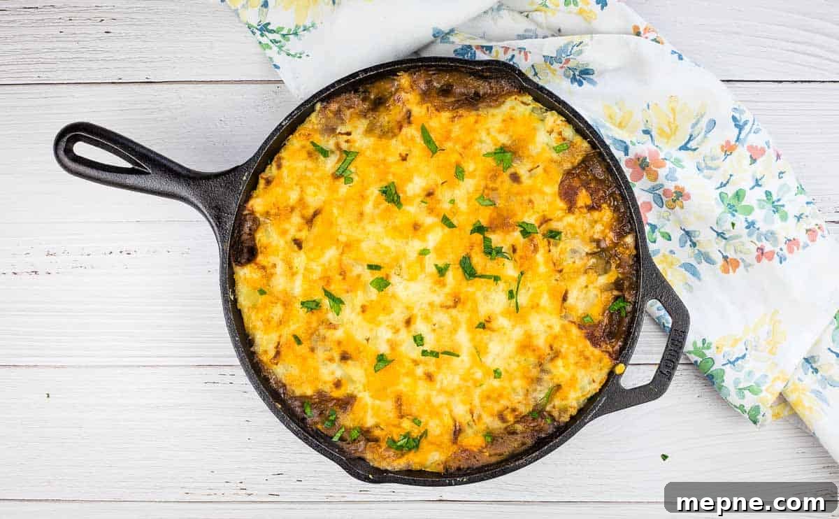 35 Classic Casserole Recipes That Have Everyone Coming Back 24 Leftover Roast Beef Shepherd's Pie in a cast iron dish.