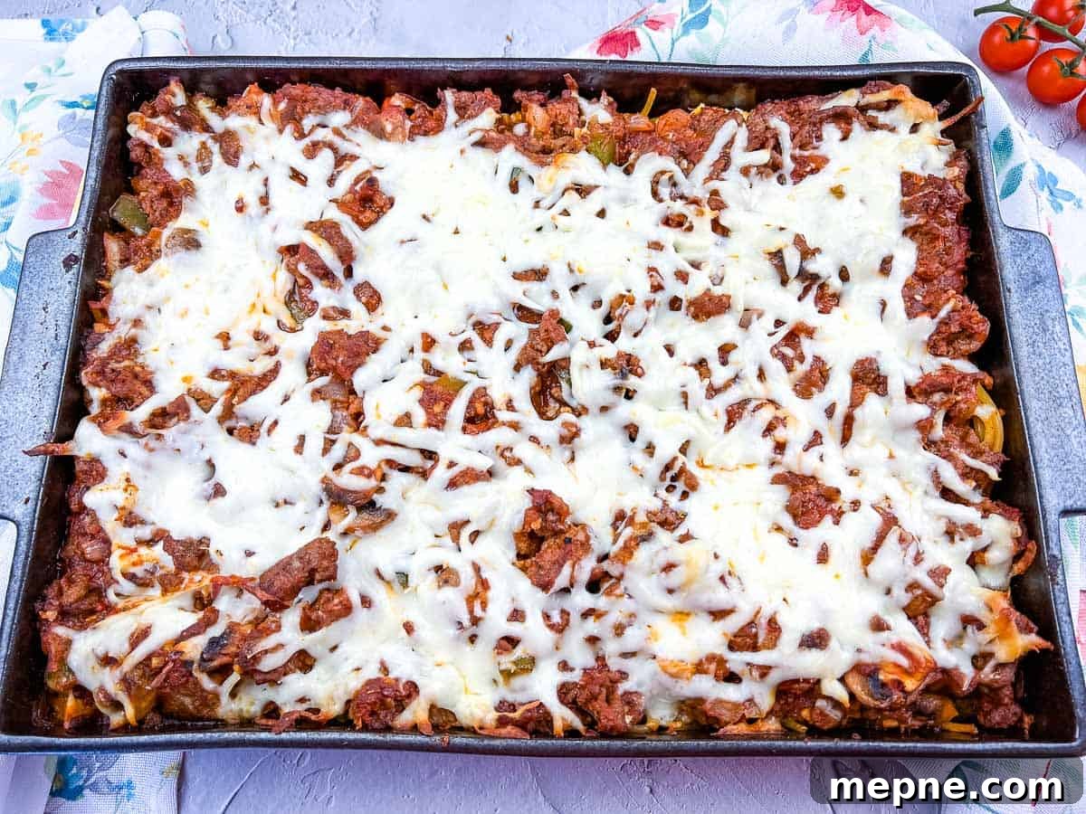 35 Classic Casserole Recipes That Have Everyone Coming Back 28 Spaghetti with meat and cheese in a baking dish.