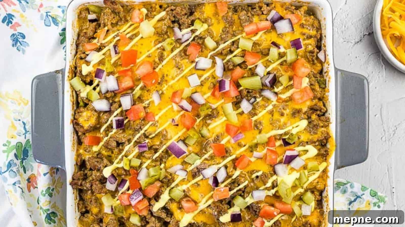 35 Classic Casserole Recipes That Have Everyone Coming Back 31 Cheeseburger Casserole in a baking dish.