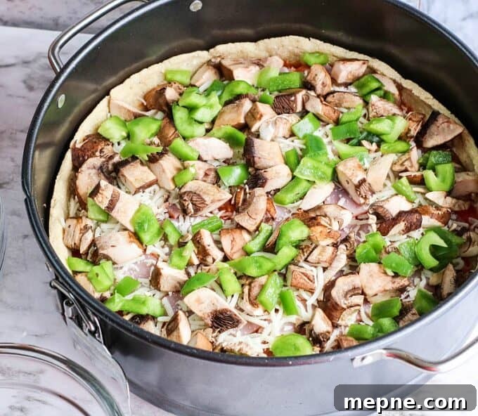 mushrooms and peppers on pizza dough.