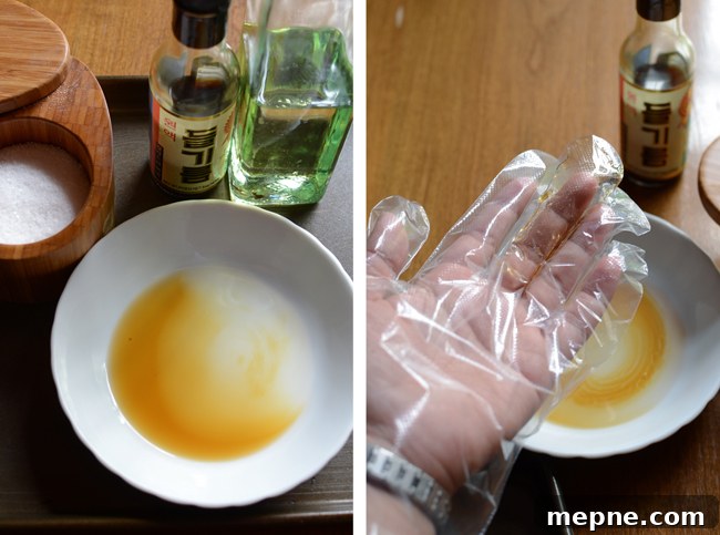 How to Make Crispy Roasted Seaweed Snacks at Home 4 A hand with a disposable plastic glove is rubbing the oil mix.