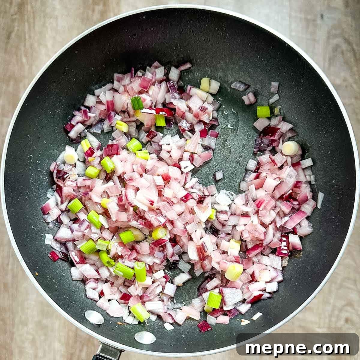 Authentic Bavarian Potato Salad with Bacon Recipe 12 scallions added to a pan with cooked onions and bacon fat.