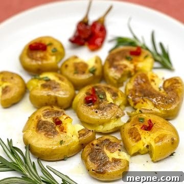 Smashed, pan-fried baby yellow potatoes with rosemary and Calabrian chilis