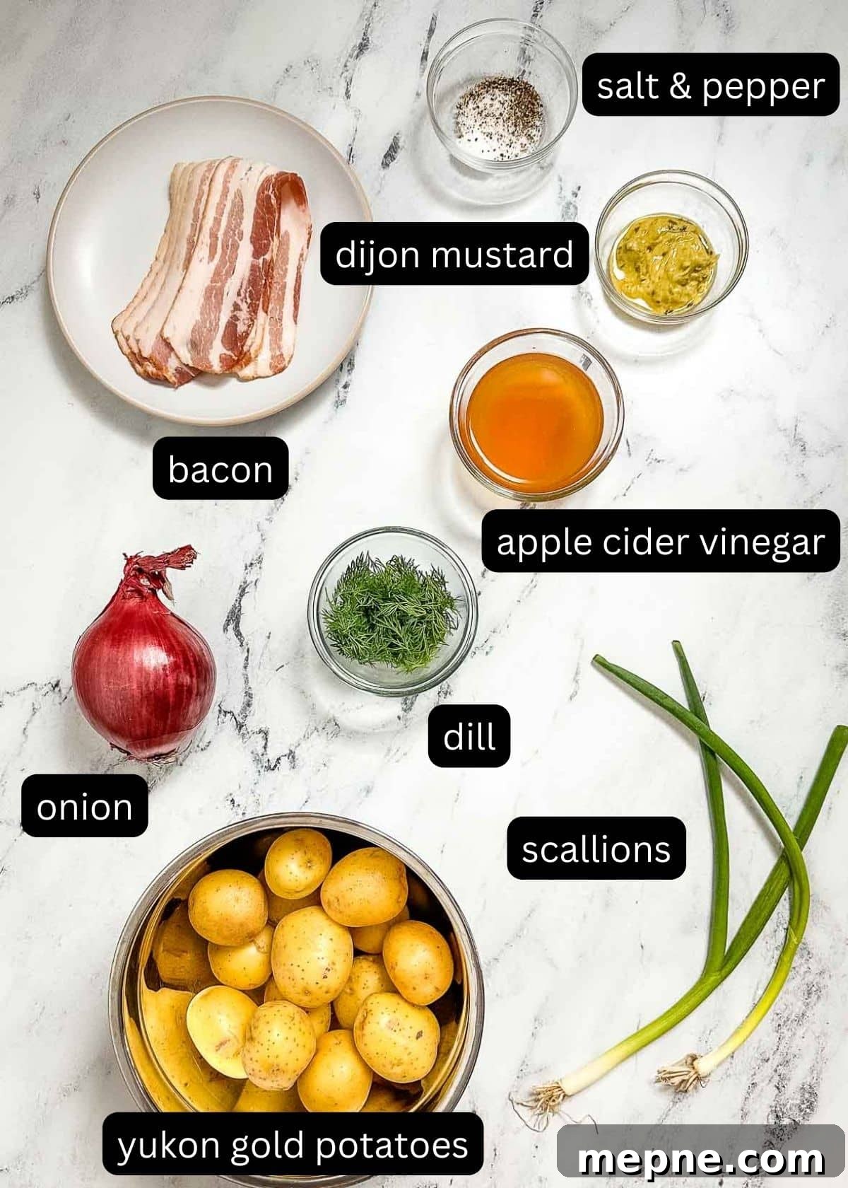 Authentic Bavarian Potato Salad with Bacon Recipe 4 the labeled ingredients for bavarian potato salad on a white marble counter.