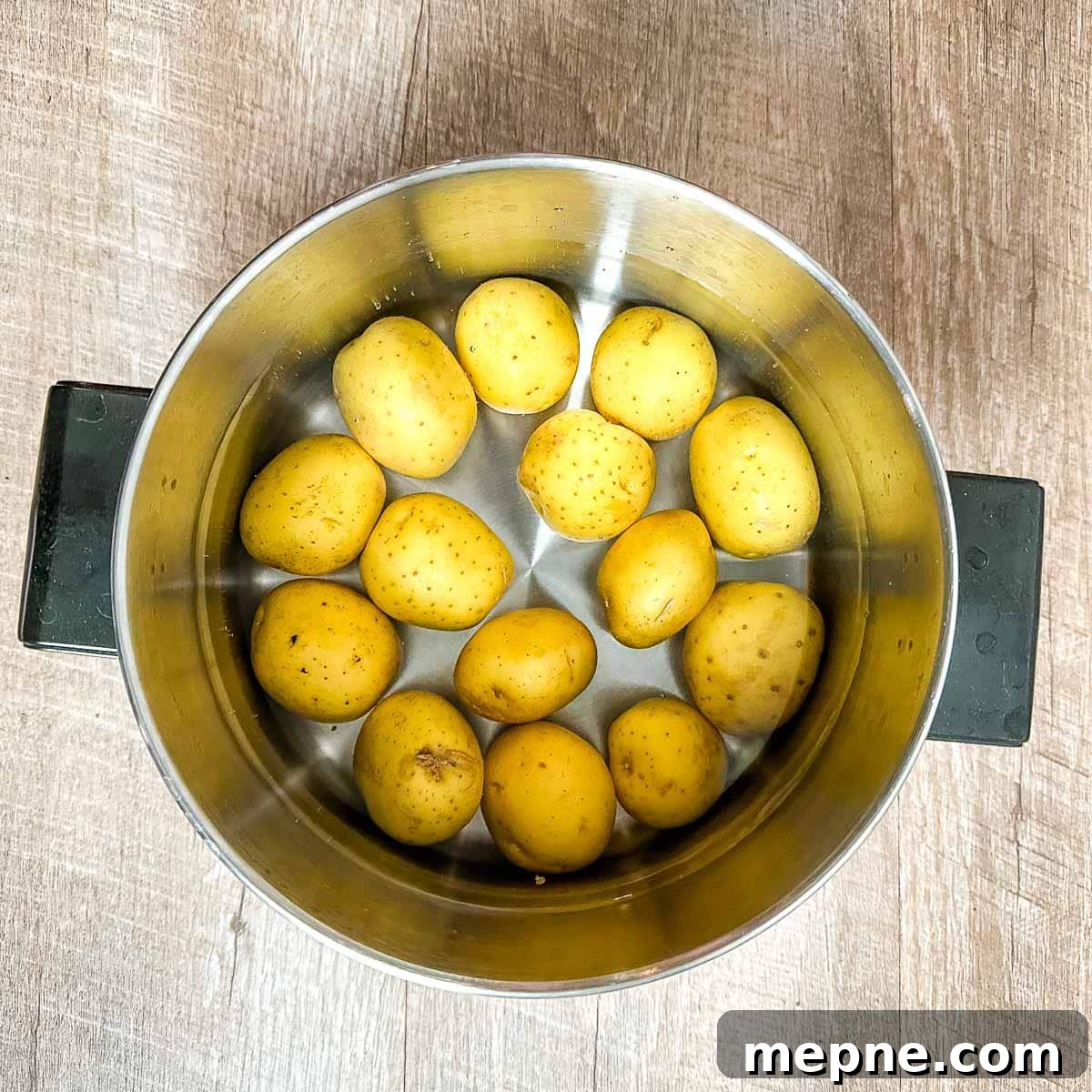 Authentic Bavarian Potato Salad with Bacon Recipe 6 yukon gold potatoes in a pot covered with cold water.