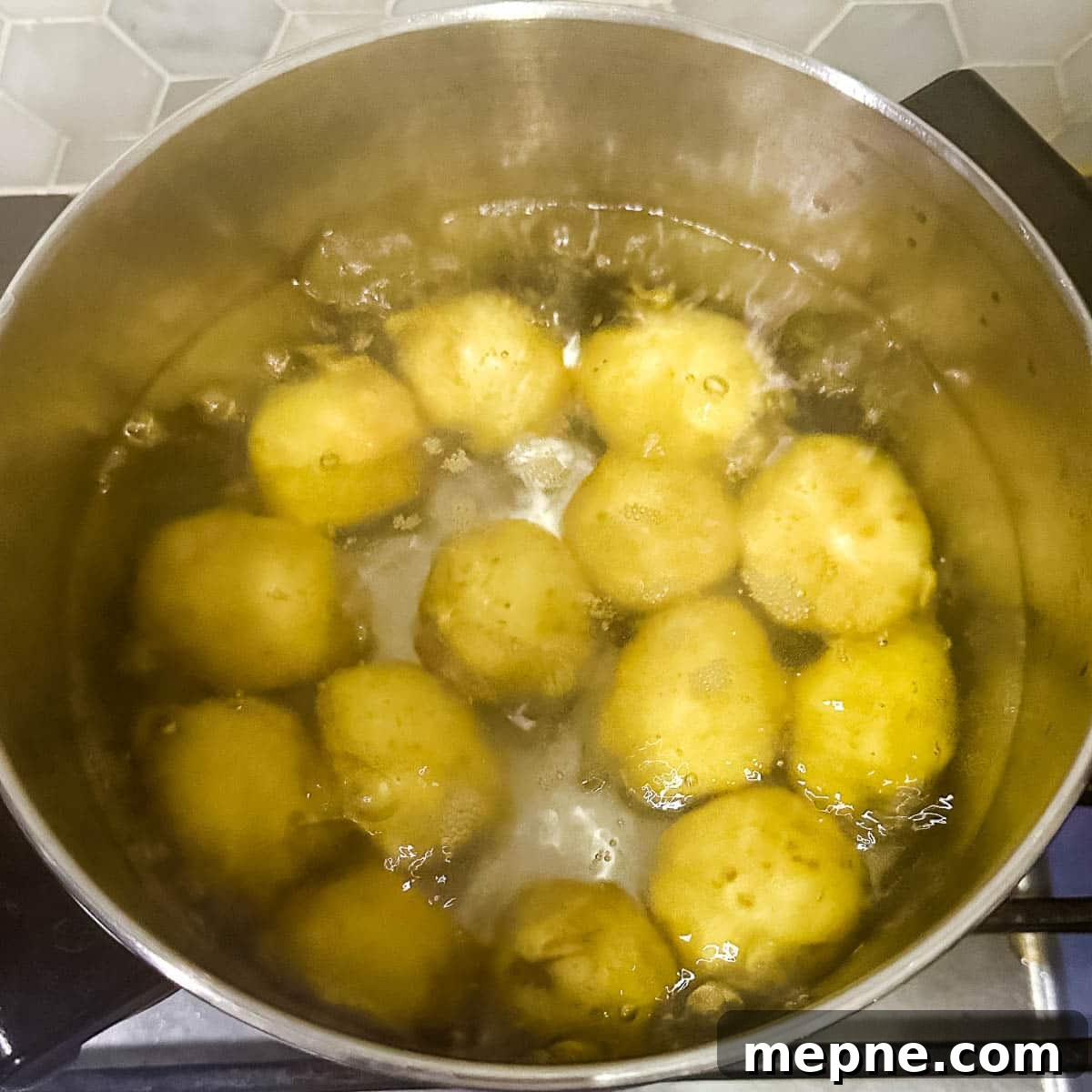 Authentic Bavarian Potato Salad with Bacon Recipe 7 boiling potatoes in a stock pot.