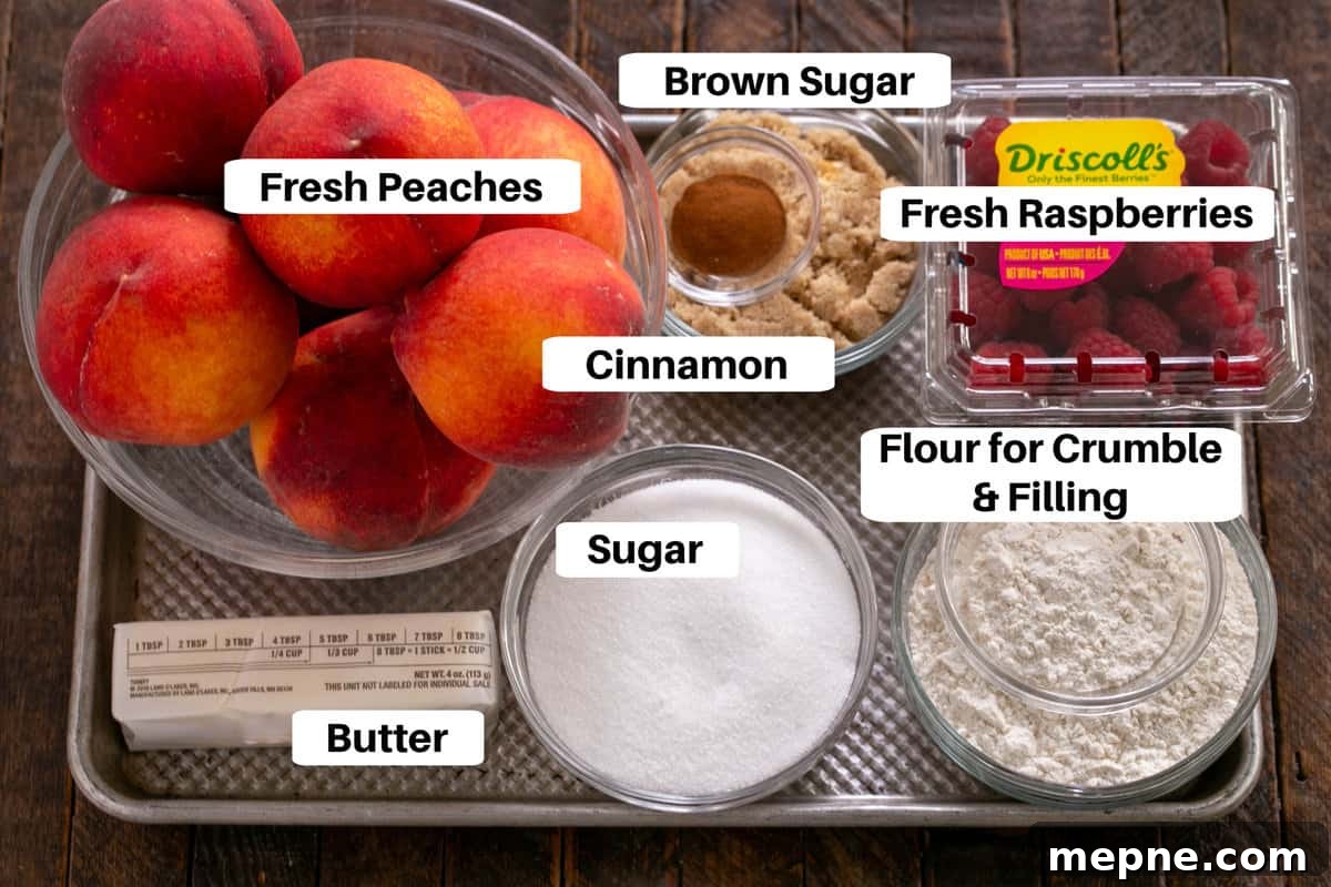 Peach Raspberry Crisp Recipe with Crunchy Oat Topping 2 Peach Raspberry Crisp ingredients on a sheet pan with labels.