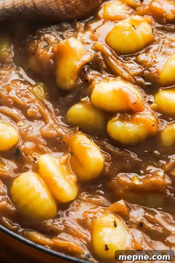French Onion Gnocchi with Gruyere 10 cooked gnocchi in a skillet mixed with french onion sauce