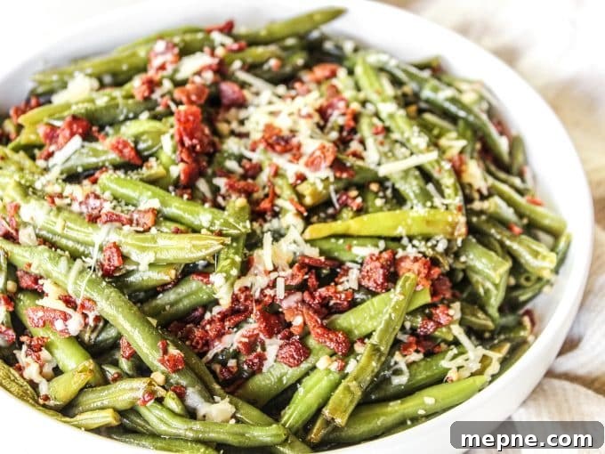 Parmesan Bacon Green Beans Recipe 3 Green beans with bacon and parmesan in a skillet