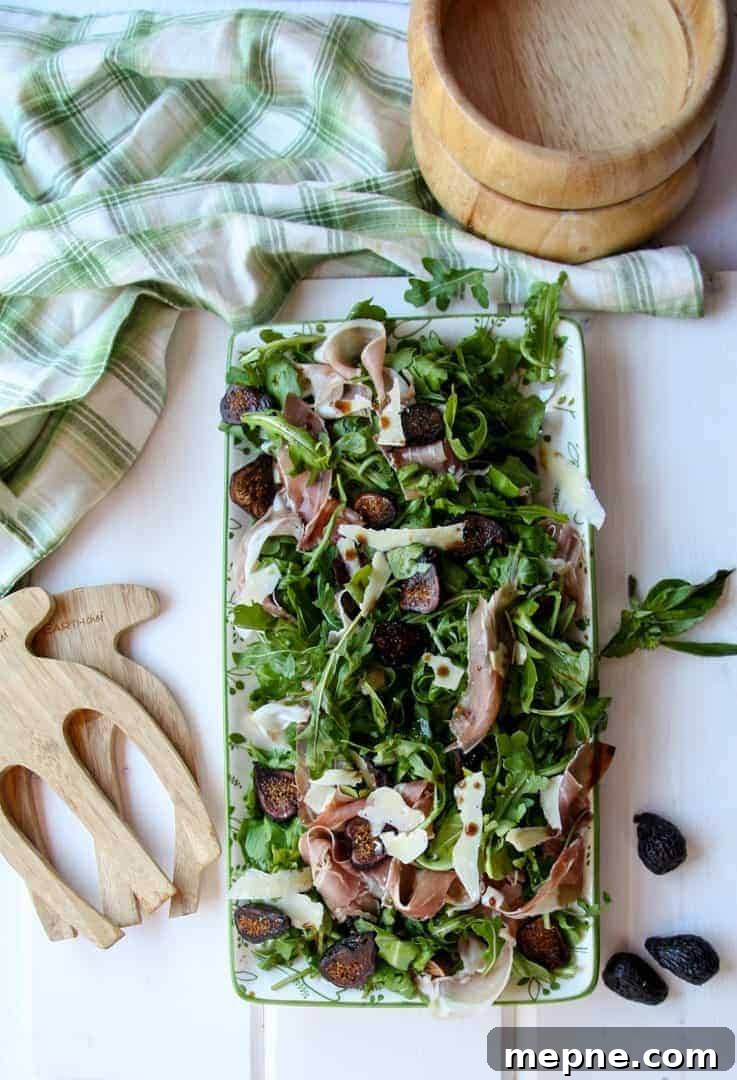 Fig, Prosciutto and Arugula Salad Recipe 3 Platter of Fig Salad with wooden salad bowls and tongs