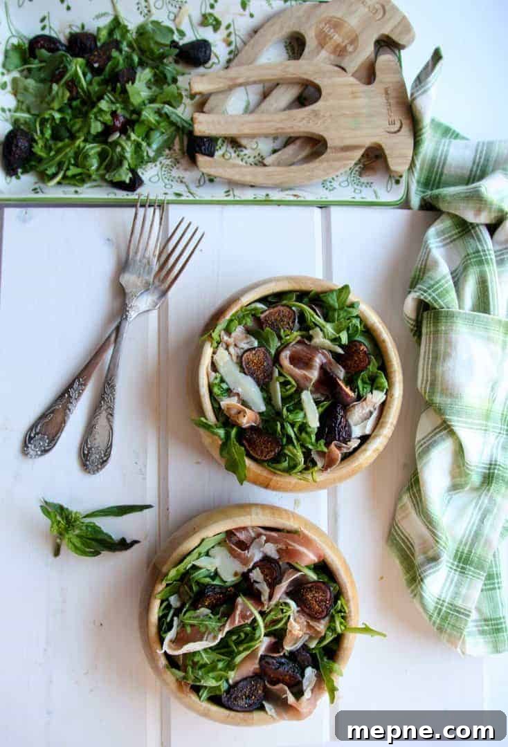 Fig, Prosciutto and Arugula Salad Recipe 4 Two wooden bowls of fig salad beside a half empty salad platter