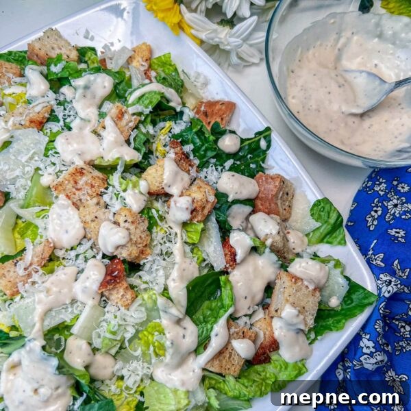 Homemade Caesar Dressing Without Anchovy Paste 2 caesar salad dressing on salad with dressing next to it