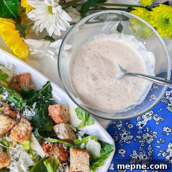 Homemade Caesar Dressing Without Anchovy Paste 3 caesar salad dressing in bowl next to salad