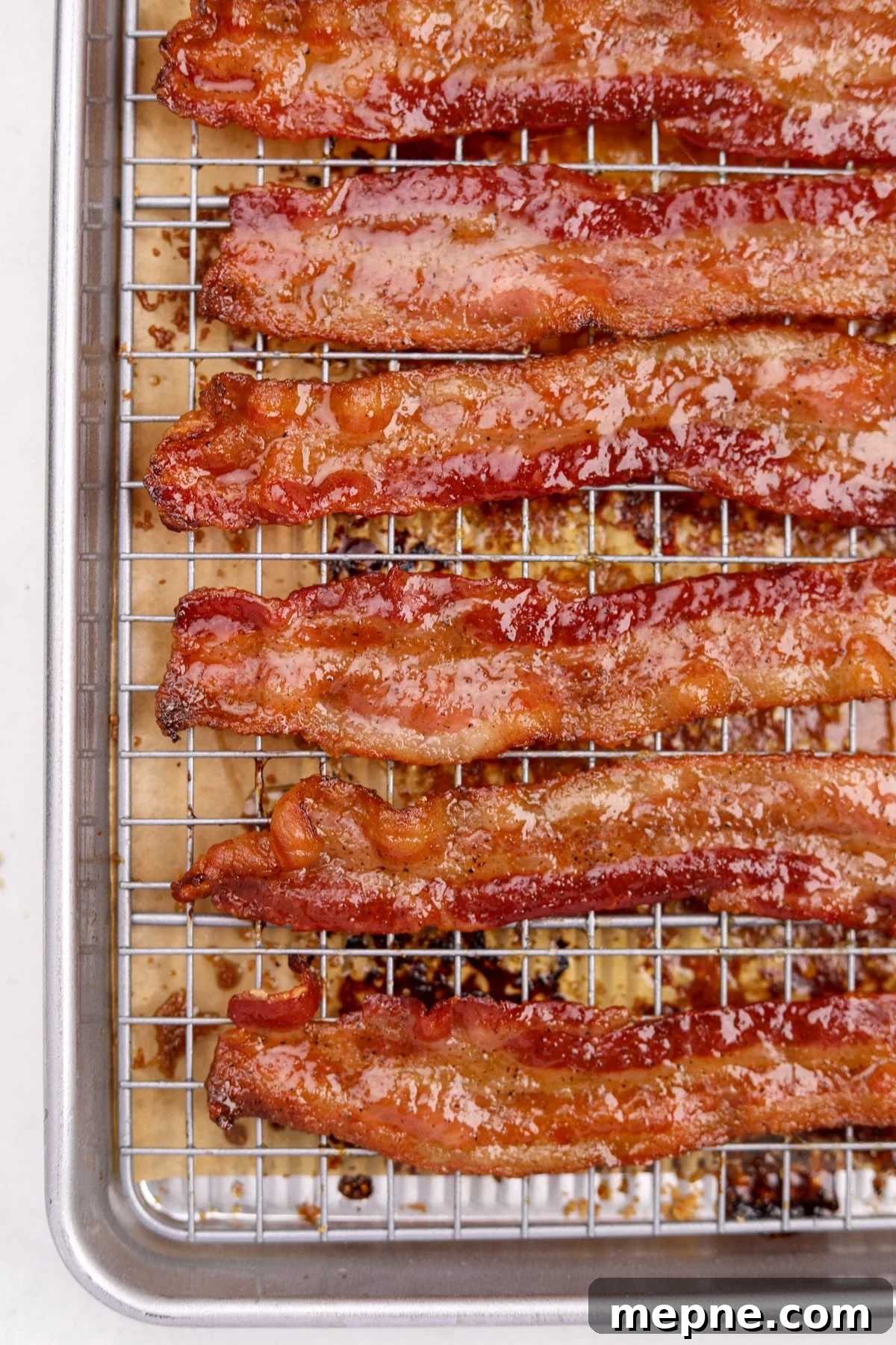 How to Make Candied Bacon: Sweet and Smoky Recipe 11 A wire baking rack filled with glazed bacon slices.