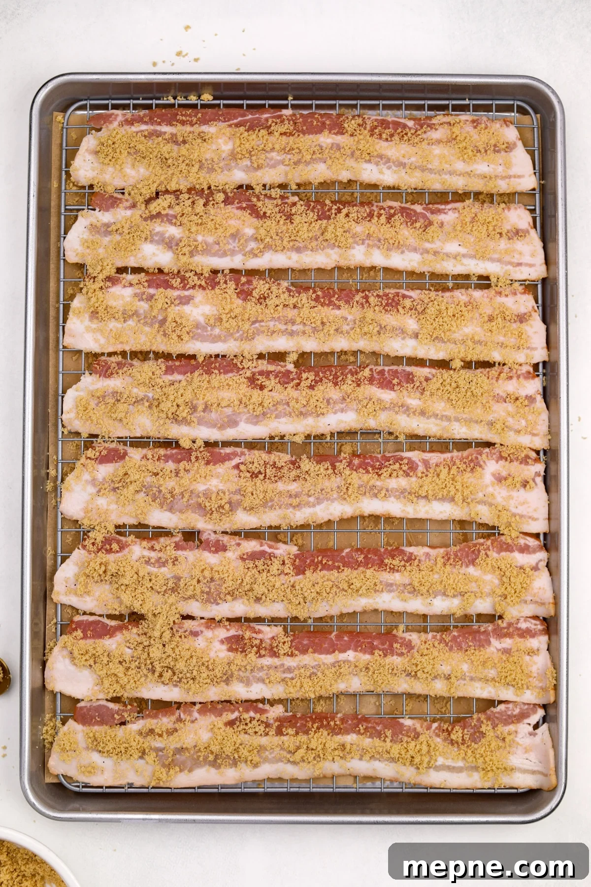 How to Make Candied Bacon: Sweet and Smoky Recipe 7 Bacon strips covered with brown sugar.