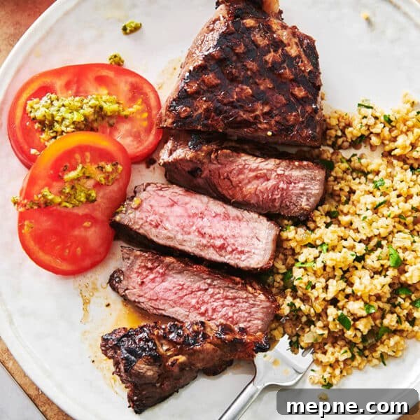 How to Get Perfect Crosshatch Grill Marks on Steak 5 Grains, tomatoes, and Grilled Marinated NY Strip Steak on a plate.