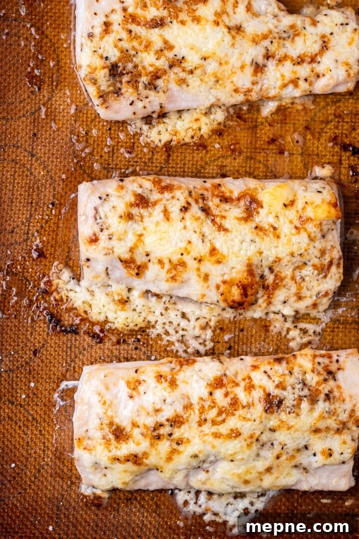Broiled Mahi Mahi with Parmesan Butter Crust 2 Sheet pan with mahi mahi fillets topped with a golden brown parmesan butter