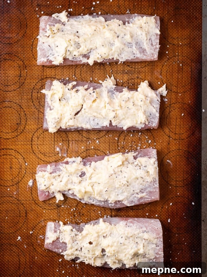 Broiled Mahi Mahi with Parmesan Butter Crust 7 Parmesan butter mixture spread all over raw fish fillets