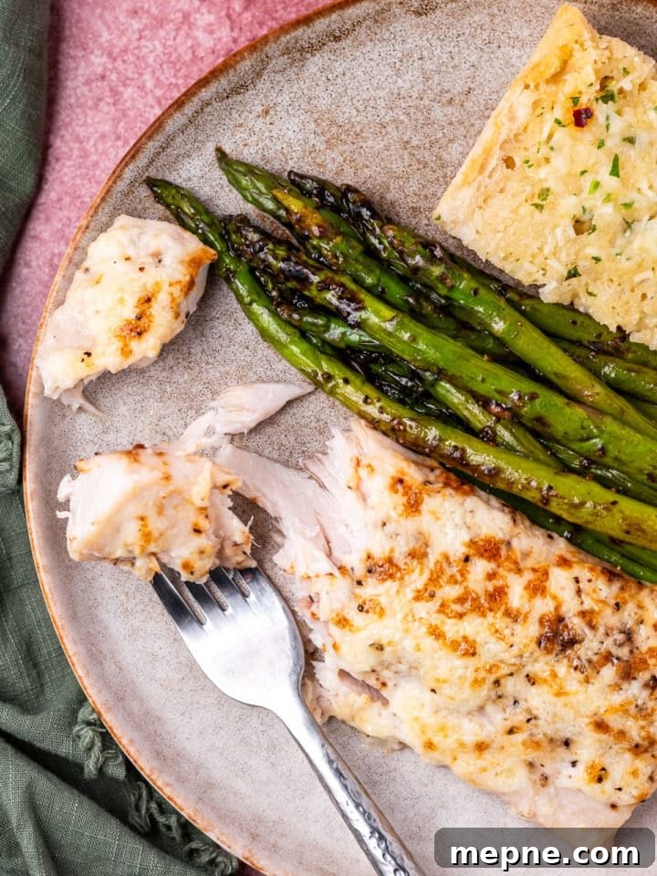Broiled Mahi Mahi with Parmesan Butter Crust 10 Flaked mahi mahi fish with a bite on a fork