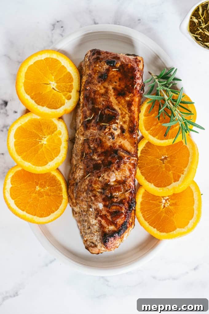 Pork Tenderloin with Orange Mustard Glaze 2 Orange Mustard Pork Tenderloin - This easy glazed tenderloin recipe is sweet and savory with orange juice and stone ground mustard. You'll never have a dry piece of pork with this homemade marinade.