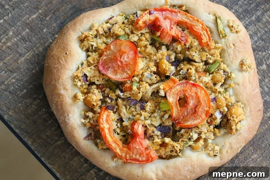 Vegan Portobello Mushrooms Stuffed with Herbed Chickpeas 2 Overhead shot of a vegan pizza with chickpea topping