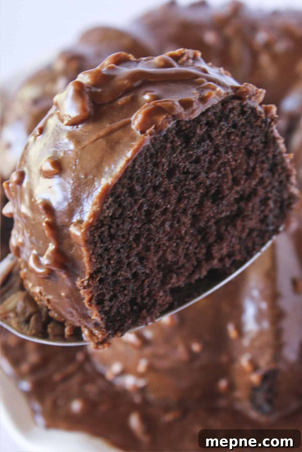 Serving a slice of Texas Sheet Cake Bundt Cake.