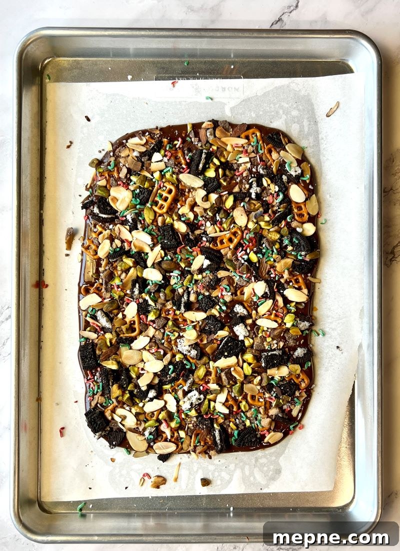 Cowboy Chocolate Christmas Bark Recipe 6 Cowboy Chocolate Christmas Bark unbroken on a sheet pan.