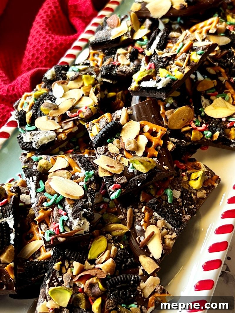 Cowboy Chocolate Christmas Bark Recipe 8 Cowboy Chocolate Christmas Bark broken in pieces on a festive plate.