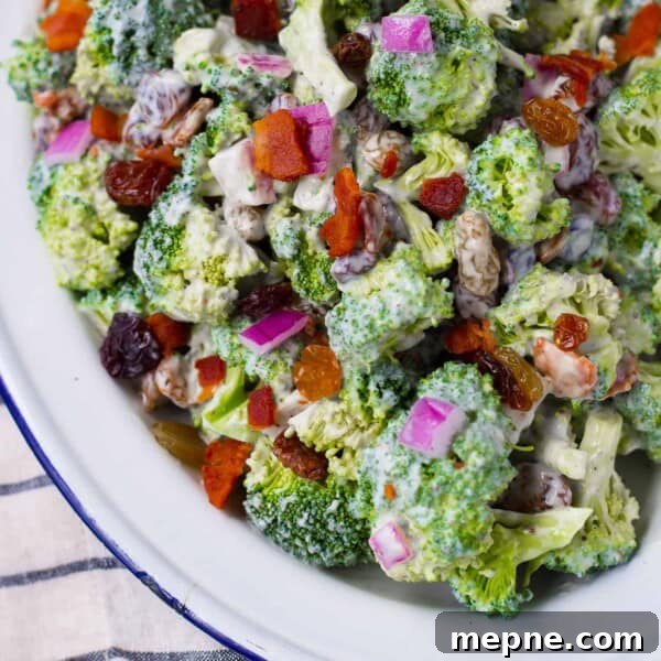 Healthy broccoli salad with bacon and red onion.
