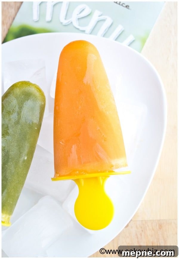 Homemade Fruit Popsicles with Fresh Fruit 3 Easy Frozen Fruit Bars on White Plate With Wood Background
