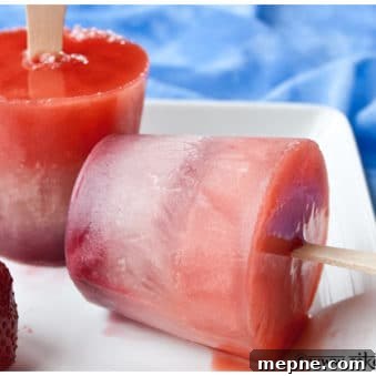 Homemade Fruit Popsicles with Fresh Fruit 5 Easy Homemade Fruit Popsicles on White Plate with Blue Background