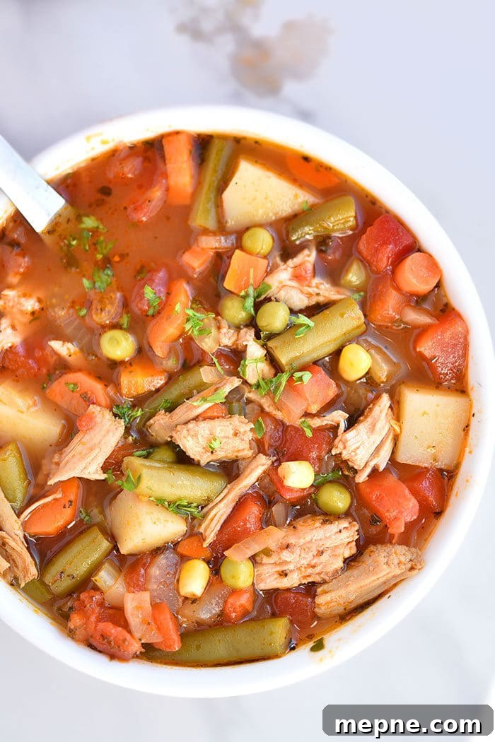 Hearty Soup in White Bowl on Marble Background.