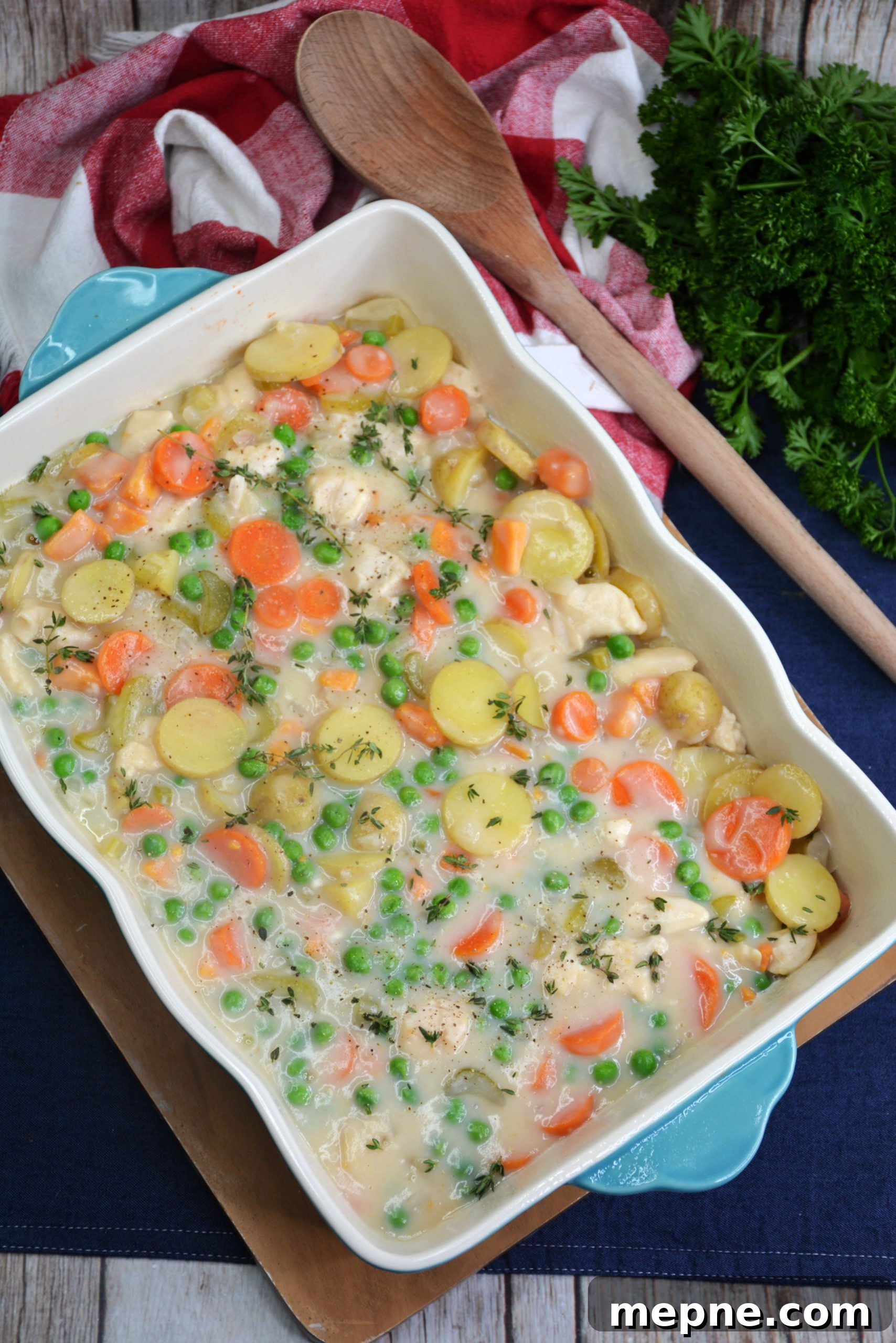 Chicken pot pie filling in baking dish