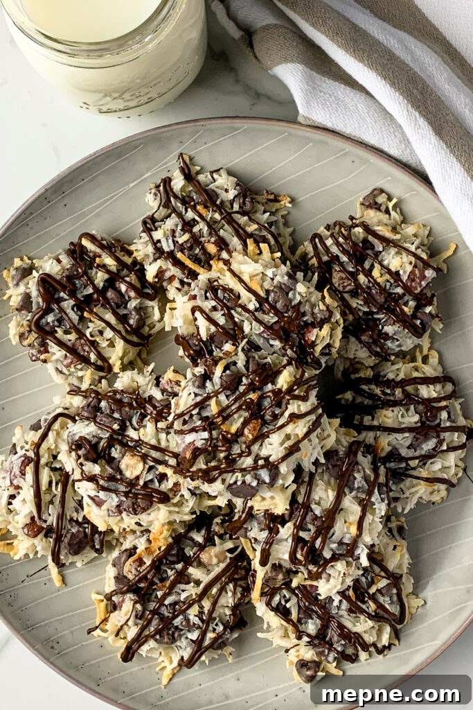 Overhead pic of almond joy cookies stacked up on a plate.
