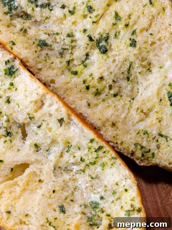 Creamy Tomato Orecchiette Pasta 9 Two slices of easy garlic bread on a cutting board.