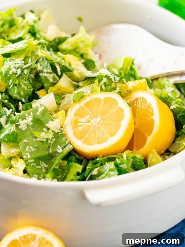 Creamy Tomato Orecchiette Pasta 10 Crunchy lemon Parmesan salad in a white bowl.