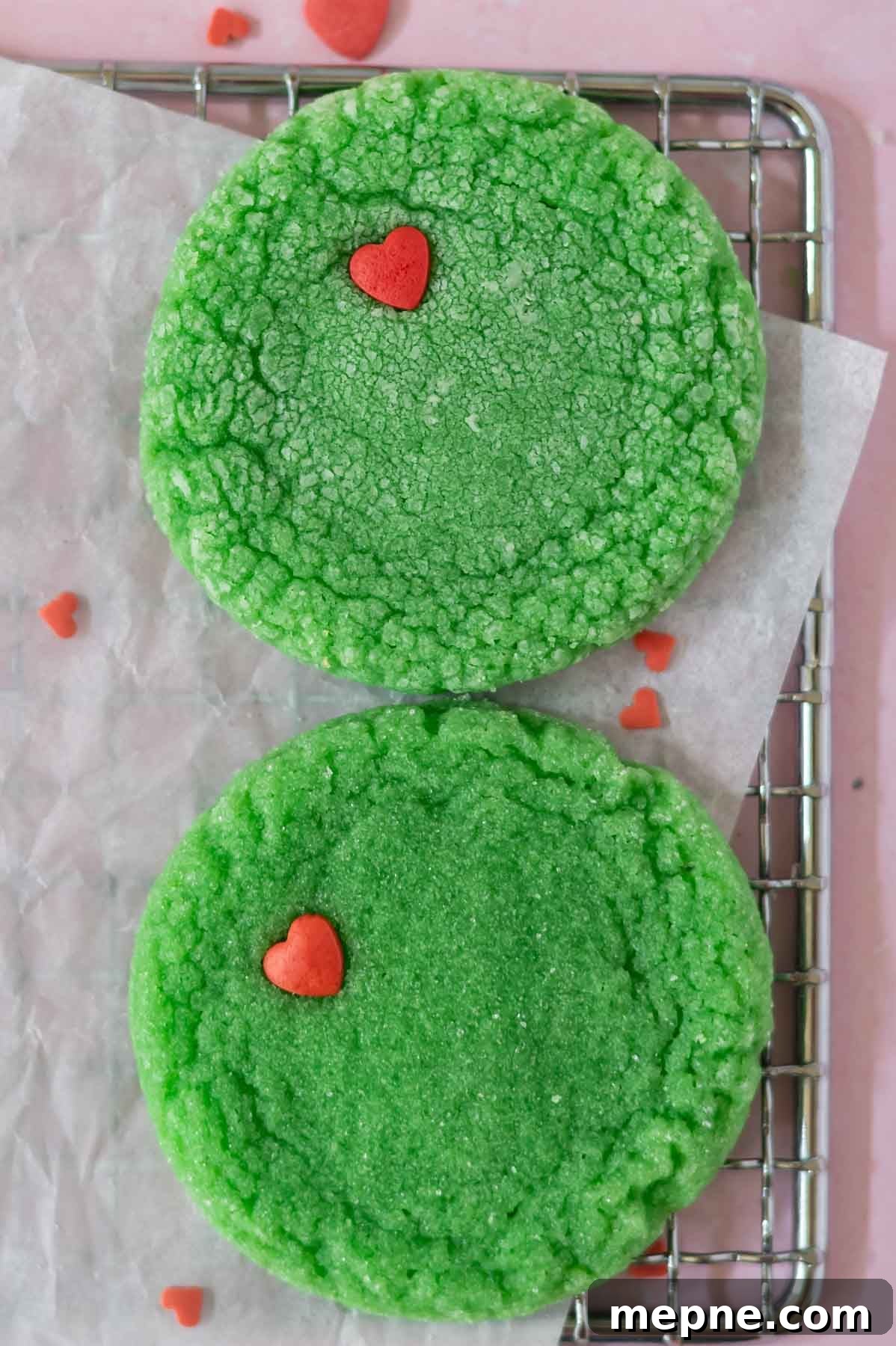 Soft Chewy Grinch Sugar Cookies for Christmas 10 two cookies on a cooling rack