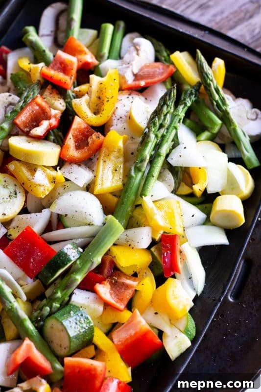 Crispy Oven Roasted Vegetables with Garlic and Herbs 7 A pan seasoned with extra virgin olive oils, salt and pepper for fresh vegetables of asparagus, peppers, onions, squash and zucchini