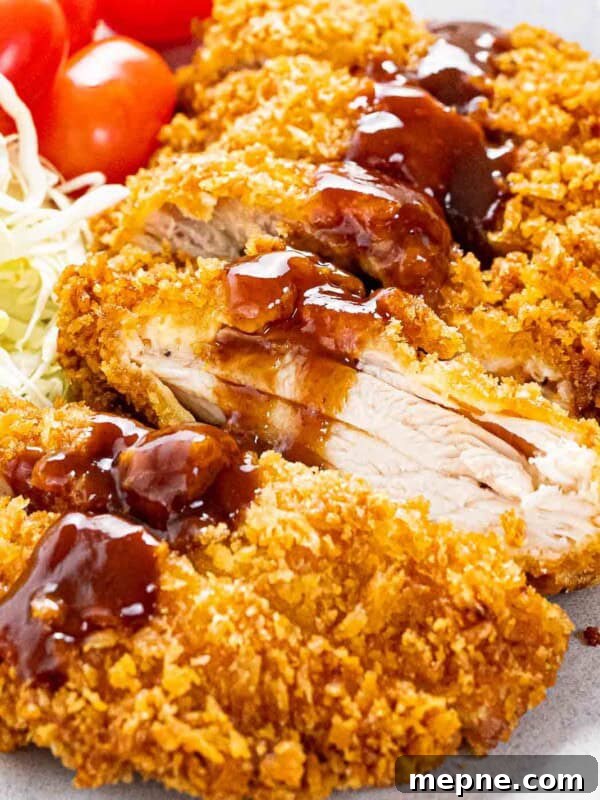 Chicken katsu coated with panko breadcrumbs and topped with katsu sauce.