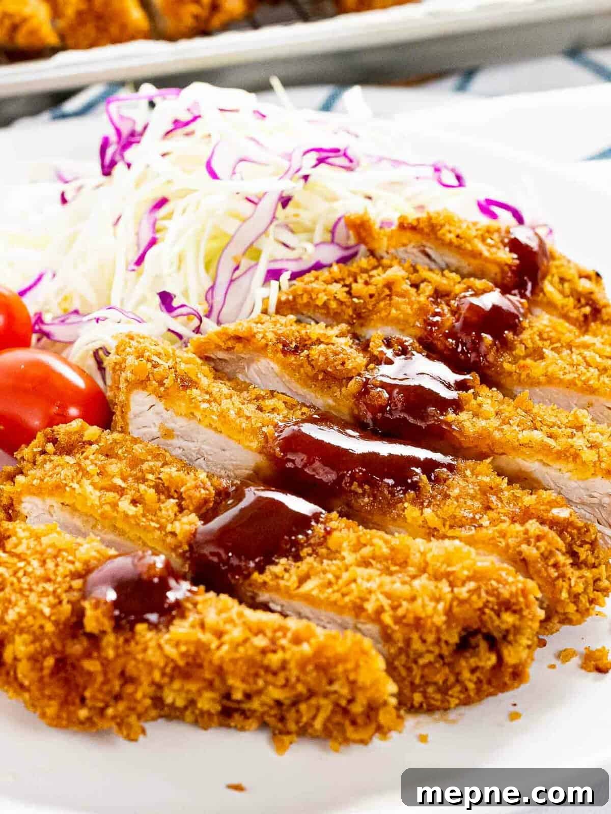 The crispiest tonkatsu with a thick layer of crispy panko breadcrumbs fried until golden brown.