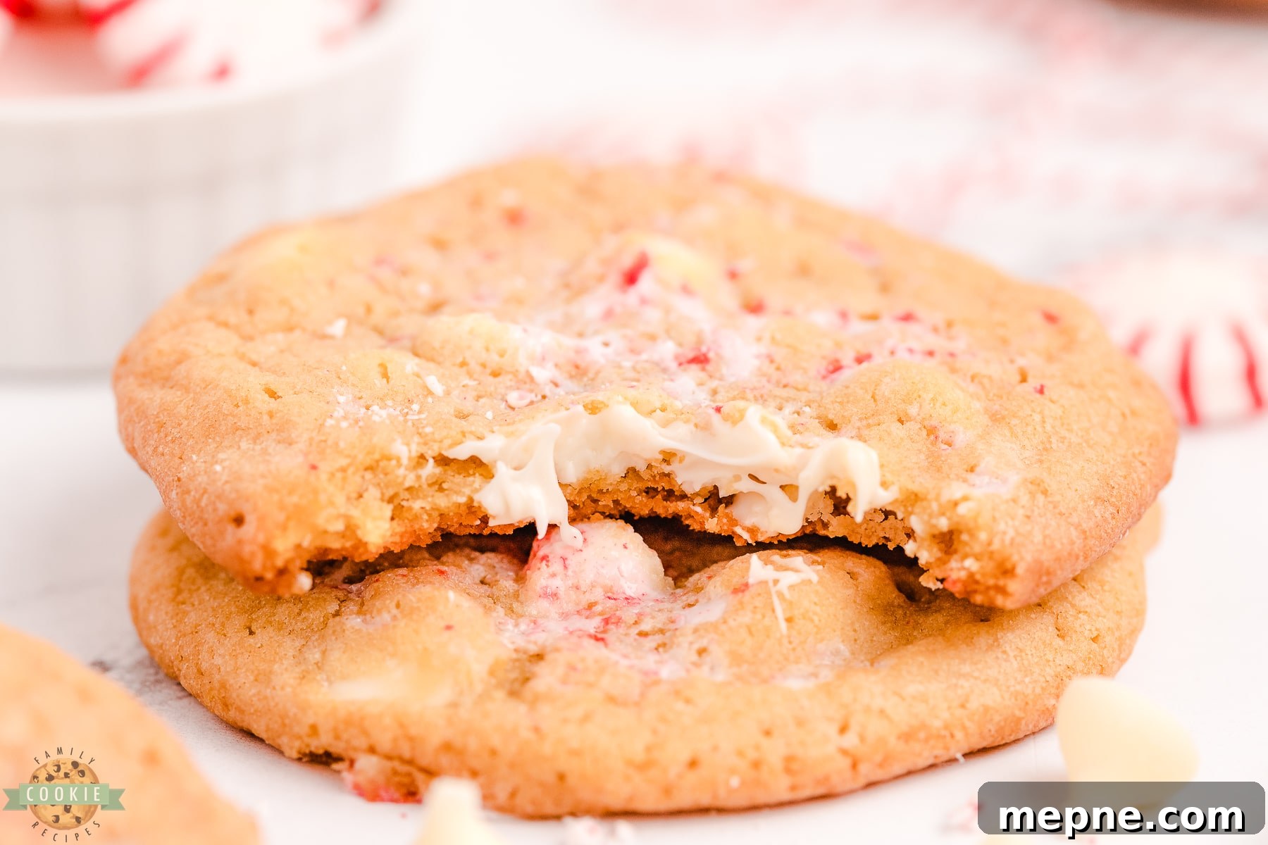 Peppermint White Chocolate Chip Cookies Recipe 6 bite taken out of a white chocolate peppermint cookie