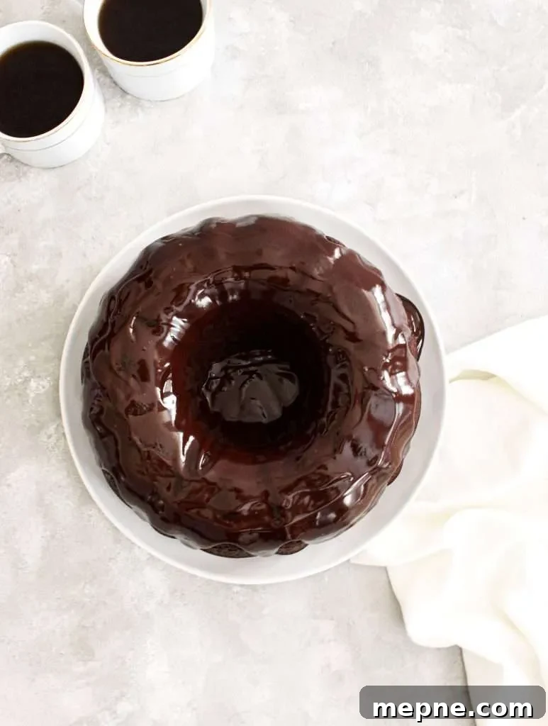 Rich Chocolate Bundt Cake with Silky Ganache Recipe 6 chocolate bundt cake topped with chocolate ganache overhead view