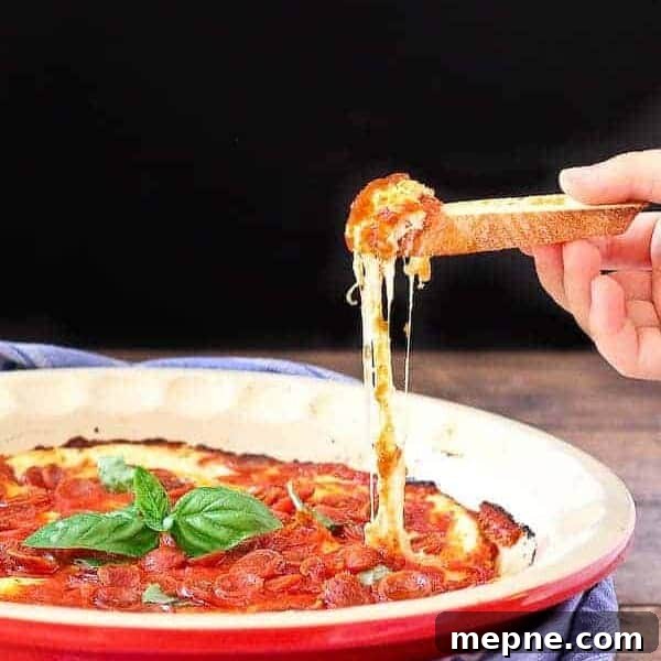 Pepperoni pizza dip in a bowl.