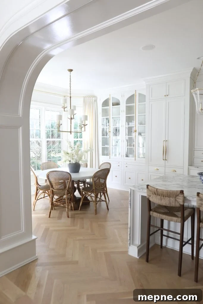 Kitchen Remodel Reveal: Before and After Transformation 8 an arch with a breakfast nook
