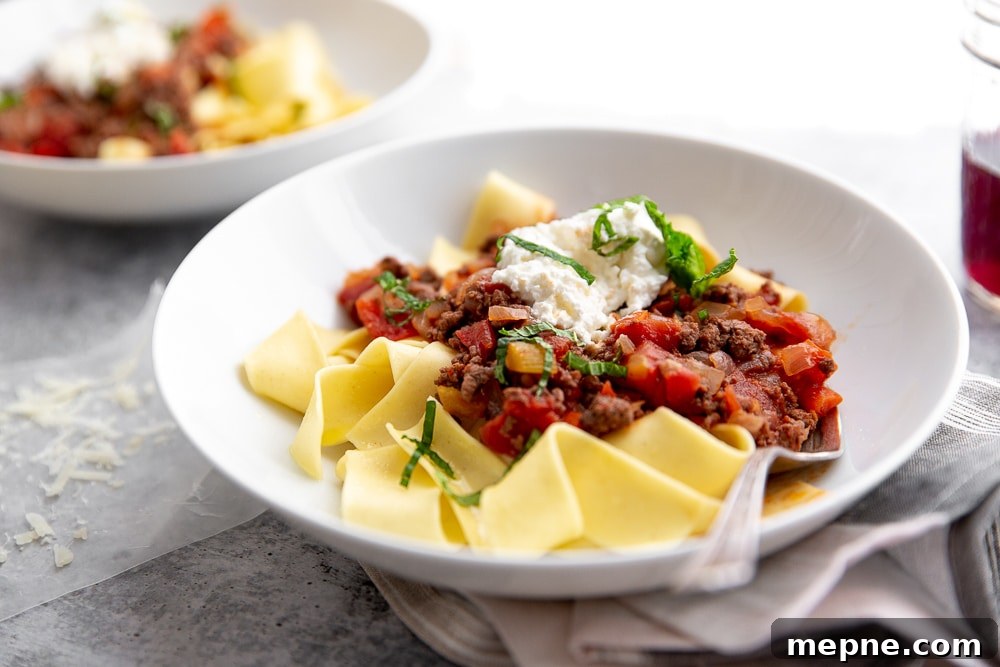 Weeknight Lamb Ragu with Fresh Mint and Ricotta 7 Lamb ragu with fresh mint and ricotta over papperdelle in bowl