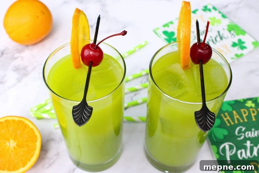 Drunken Leprechaun Irish Screwdriver Cocktail for St Patrick's Day 9 two glasses filled with drunken leprechaun sitting on a white marble table