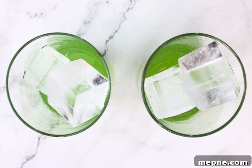 Drunken Leprechaun Irish Screwdriver Cocktail for St Patrick's Day 6 add ice to your whiskey and blue curacao